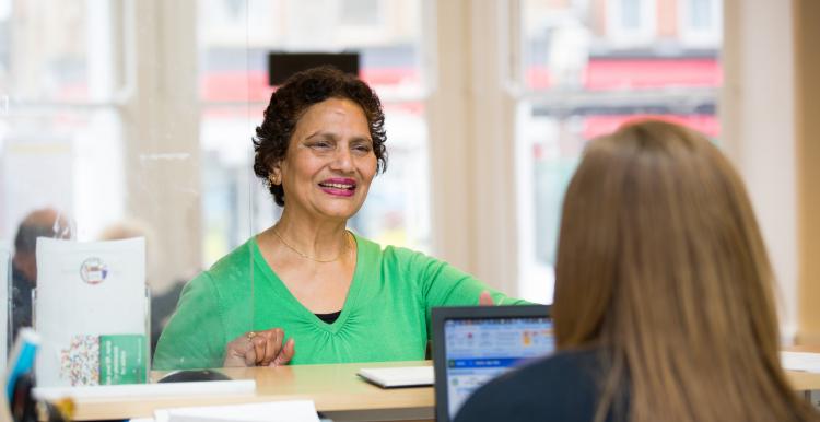 Woman at reception desk