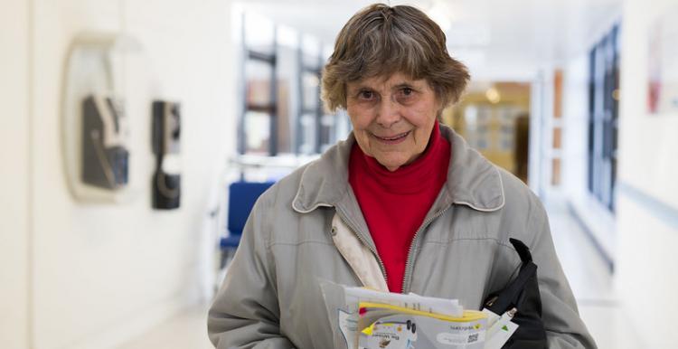 Woman holding information