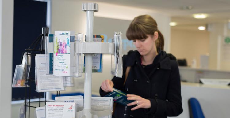 Woman reading a leaflet