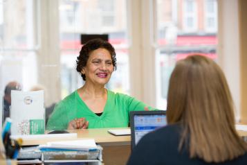 Woman at reception desk