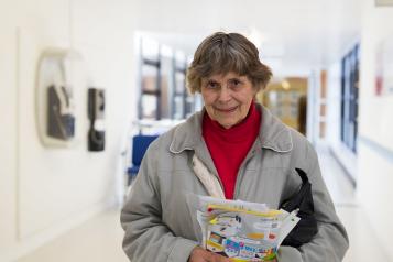 Woman holding information