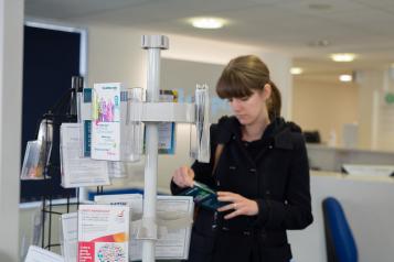 Woman reading a leaflet