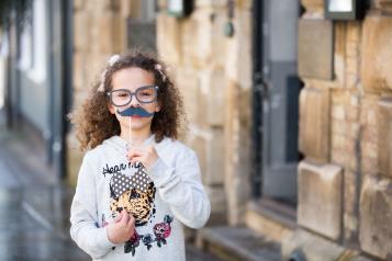 Girl with moustache mask