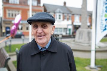 older man smiling at camera 