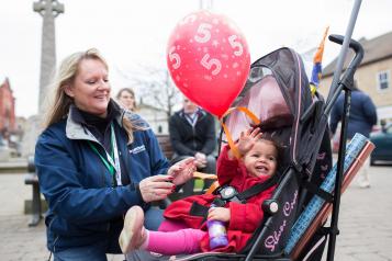 Woman and child in pushchair