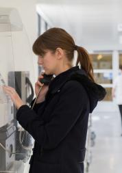 Woman at payphone