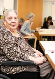 Women in powerchair at table